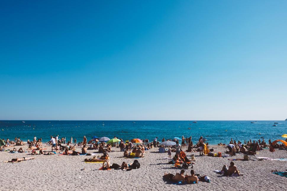 Free Image of Crowded Beach Scene on a Sunny Day 