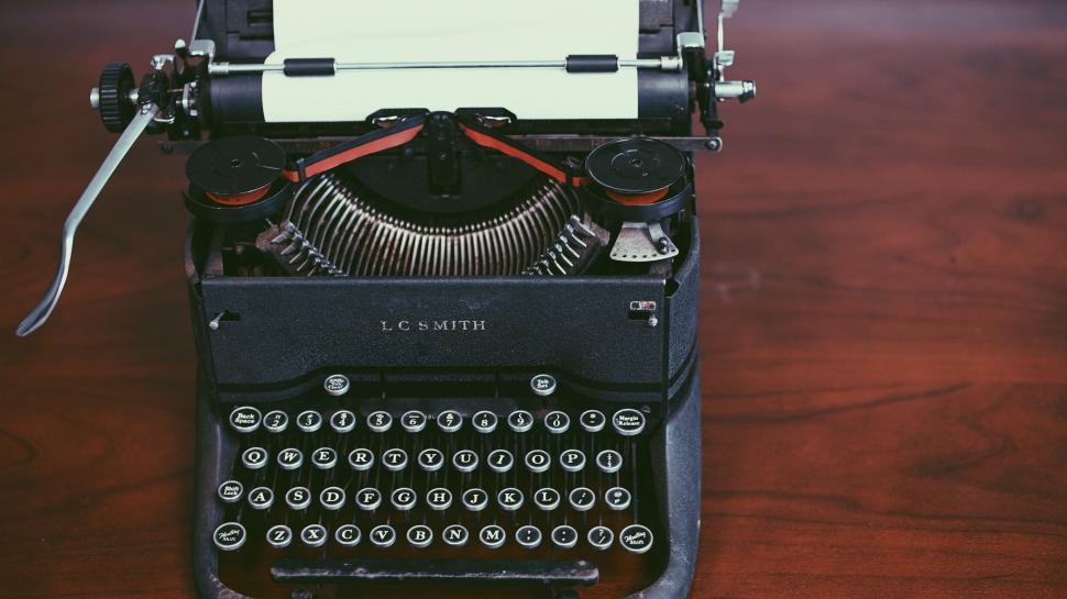 Free Image of Vintage Typewriter on Wooden Table 