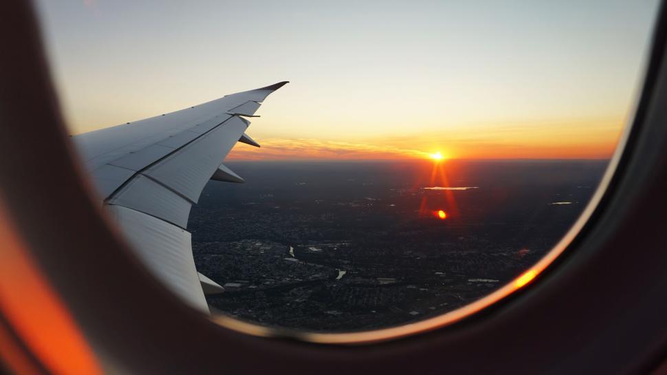 Free Image of A View of a Sunset Through an Airplane Window 