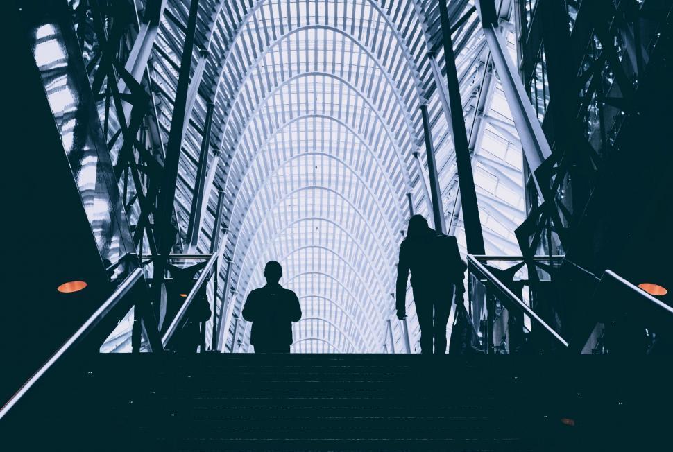 Free Image of Man and Child Walking up Stairs 