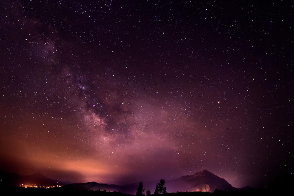 Free Image of Starry Night Sky Over Mountain 