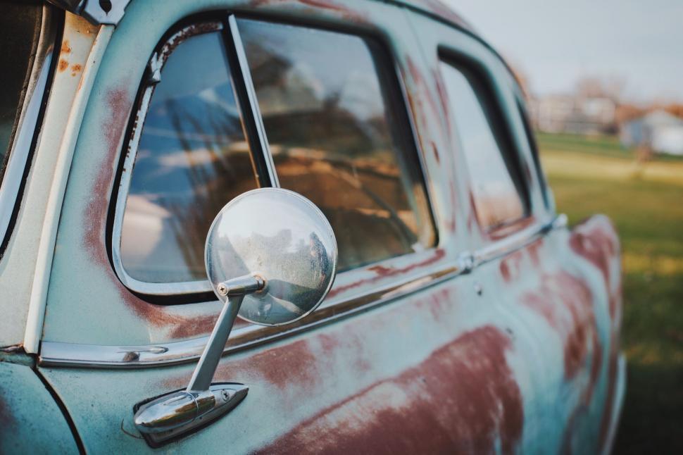 Free Image of Old Car Parked in Grassy Field 
