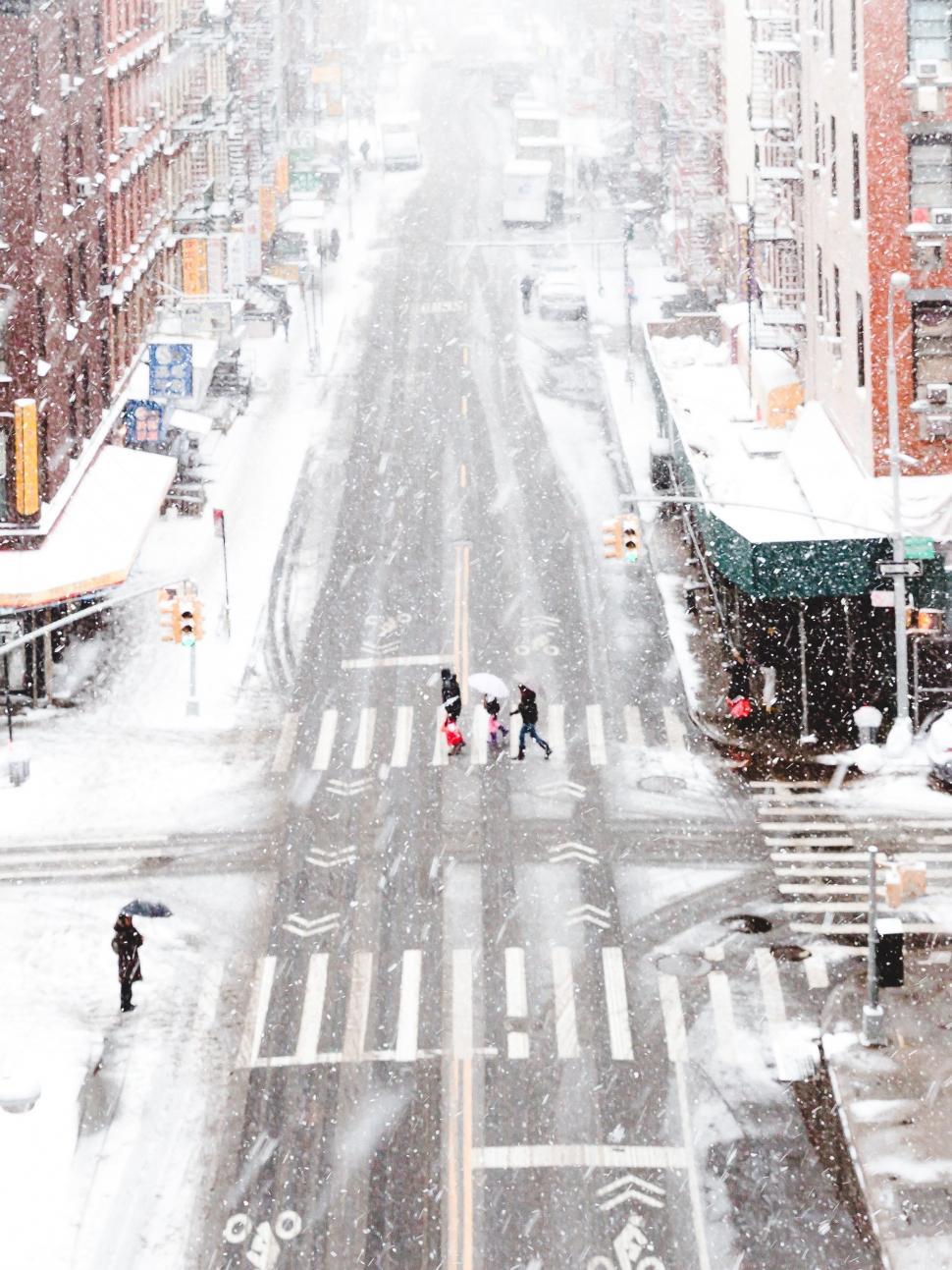 Free Image of Busy Snowy City Street With Traffic 