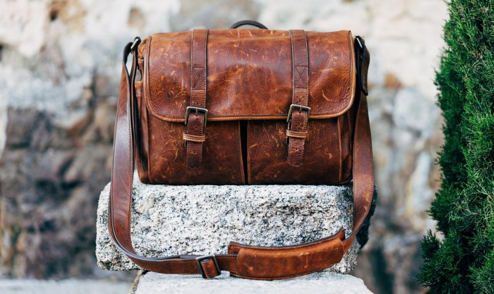 Free Image of Brown Leather Backpack on Rock 