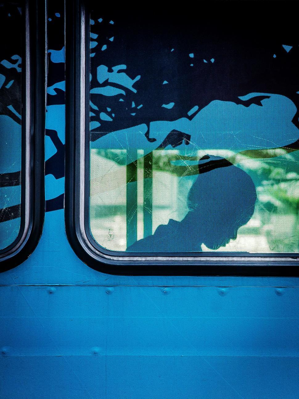 Free Image of Silhouette of Person Through Window 