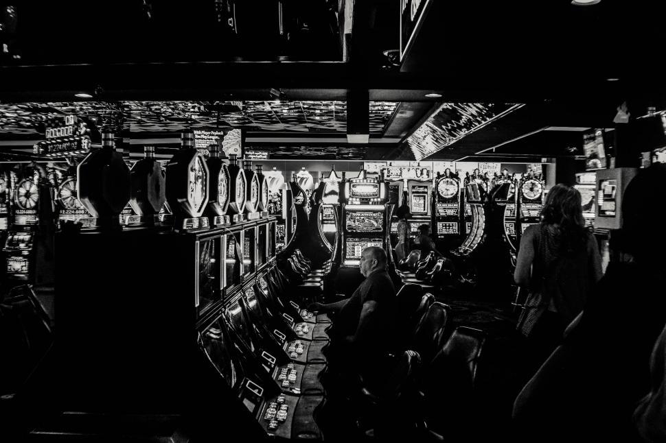Free Image of People Playing Slot Machines 