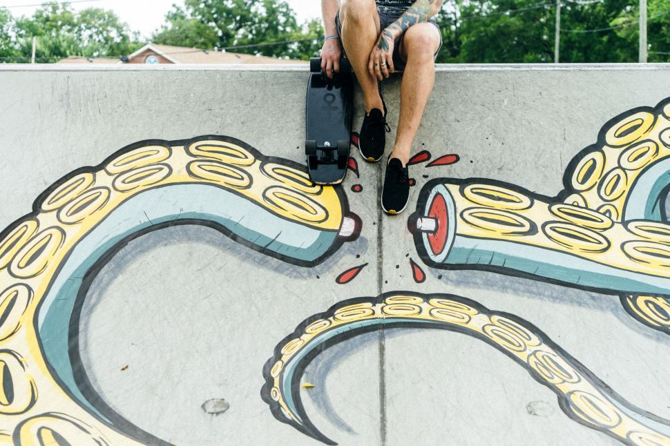 Free Image of Man Riding Skateboard on Cement Wall 
