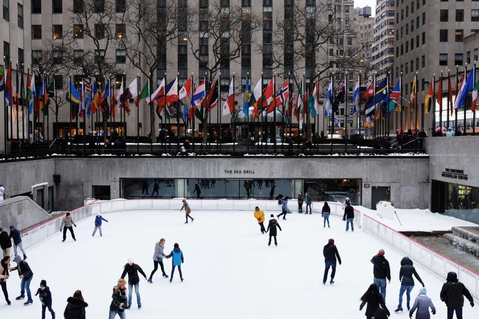 Free Image of Group of People Skating on an Ice Rink 