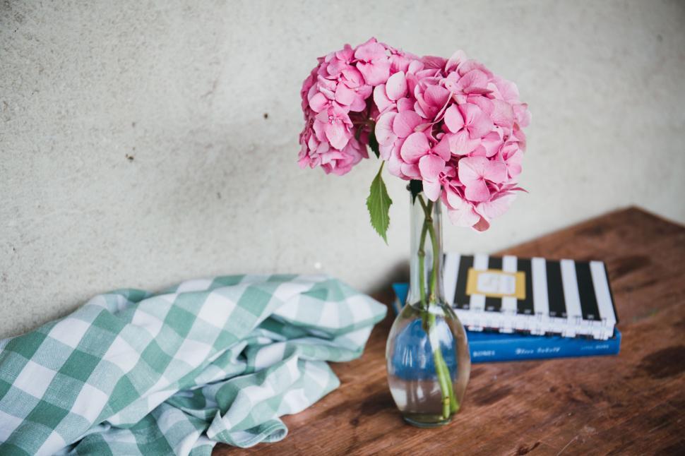 Free Image of Vase Filled With Pink Flowers on Wooden Table 