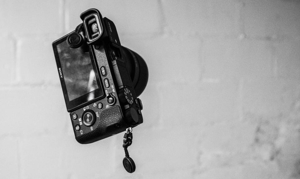 Free Image of Camera Hanging on Wall 