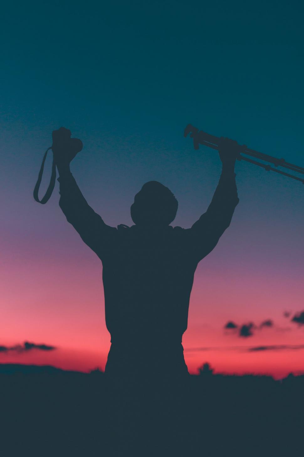 Free Image of Silhouette of Man Holding Skis 