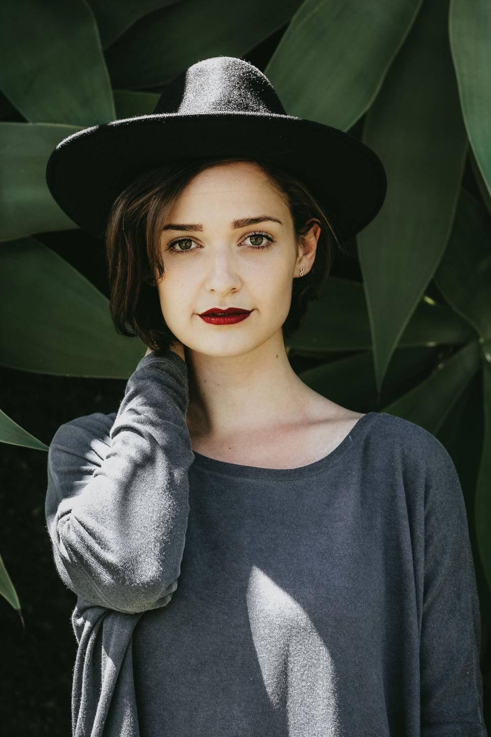 Free Image of Woman Wearing Black Hat and Gray Shirt 