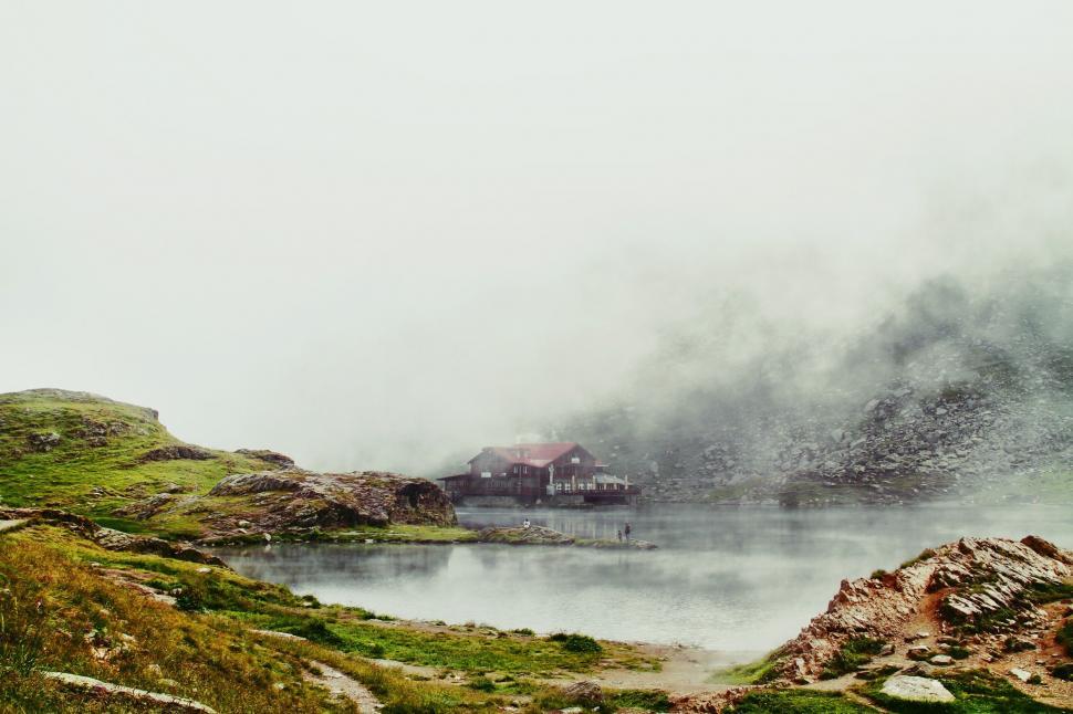 Free Image of Fog-Covered Mountain Surrounding Lake 