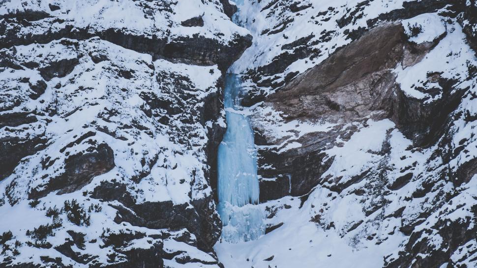 Free Image of Snow Covered Mountain With Waterfall 