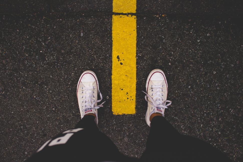 Free Image of Person Standing in Front of Yellow Line 