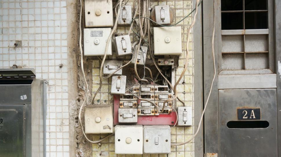Free Image of Tangled Electrical Wires on Wall 