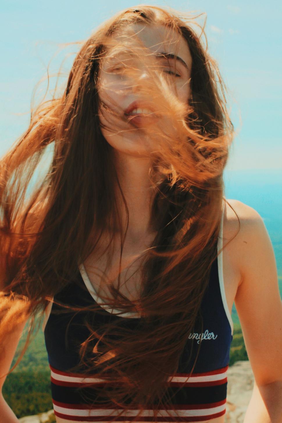 Free Image of Woman With Wind-Blown Hair 