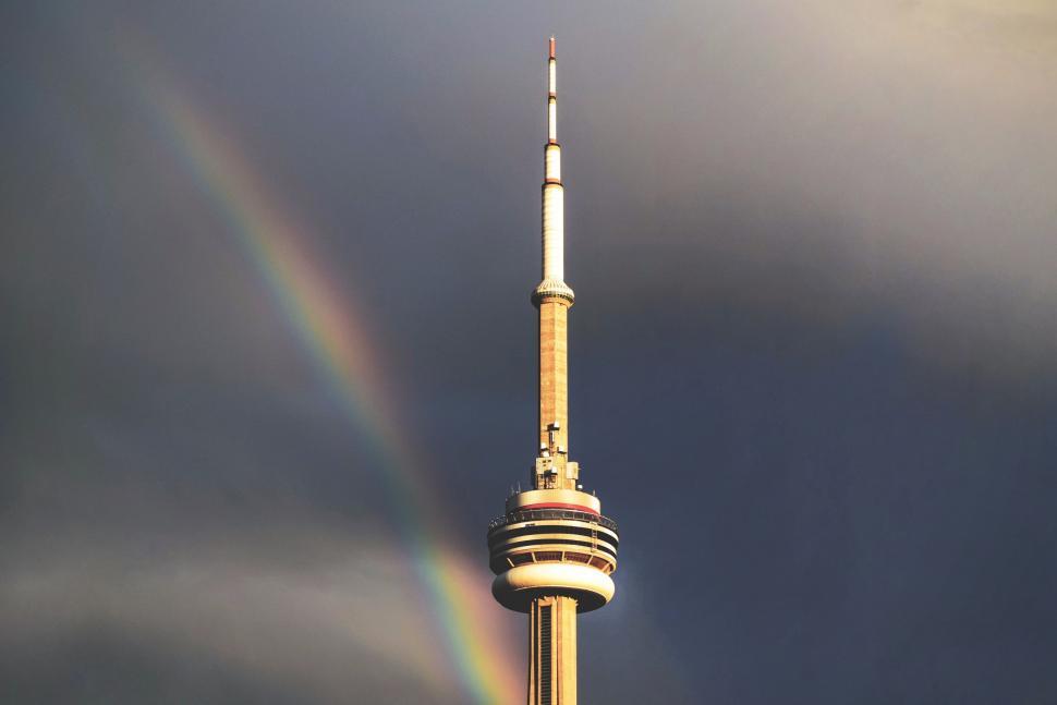 Free Image of Tower Standing Tall With Rainbow in the Sky 