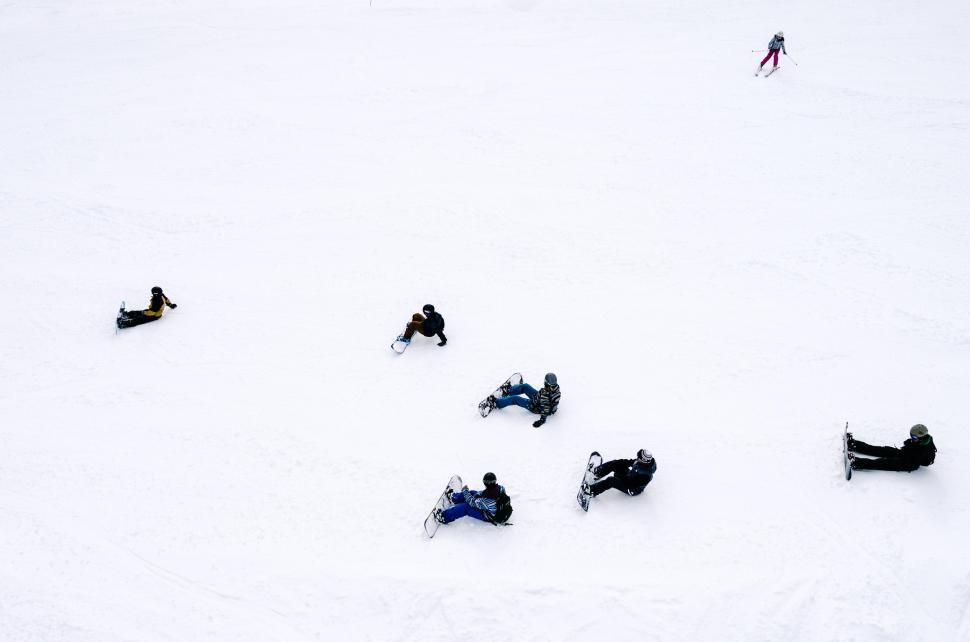 Free Image of Group of People Laying in the Snow 