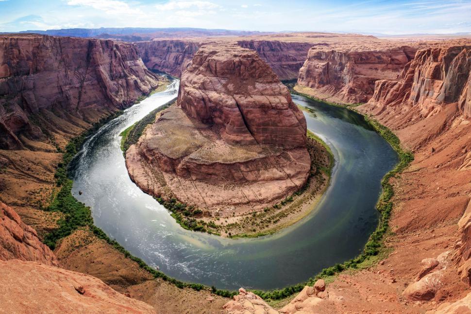 Free Image of River Flowing Through Canyon Surrounded by Mountains 