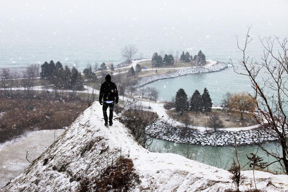 Free Image of Person Standing on Snow Covered Hill 