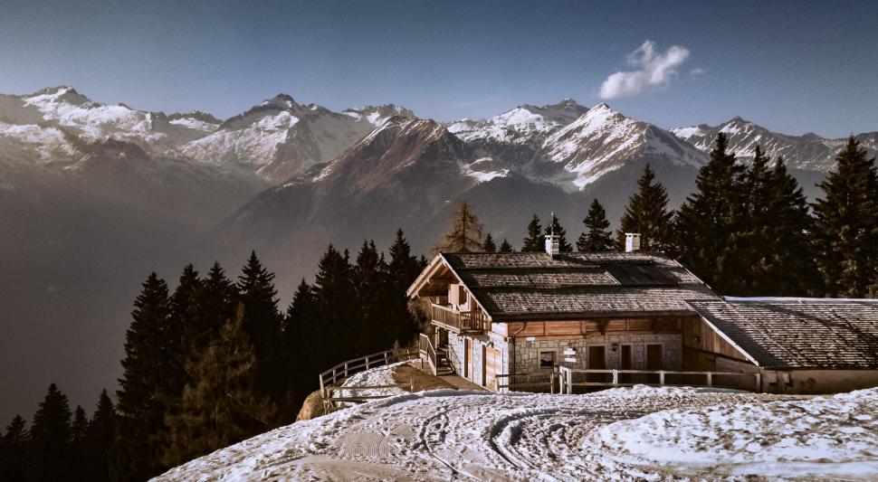 Free Image of House Perched on Snowy Hilltop 