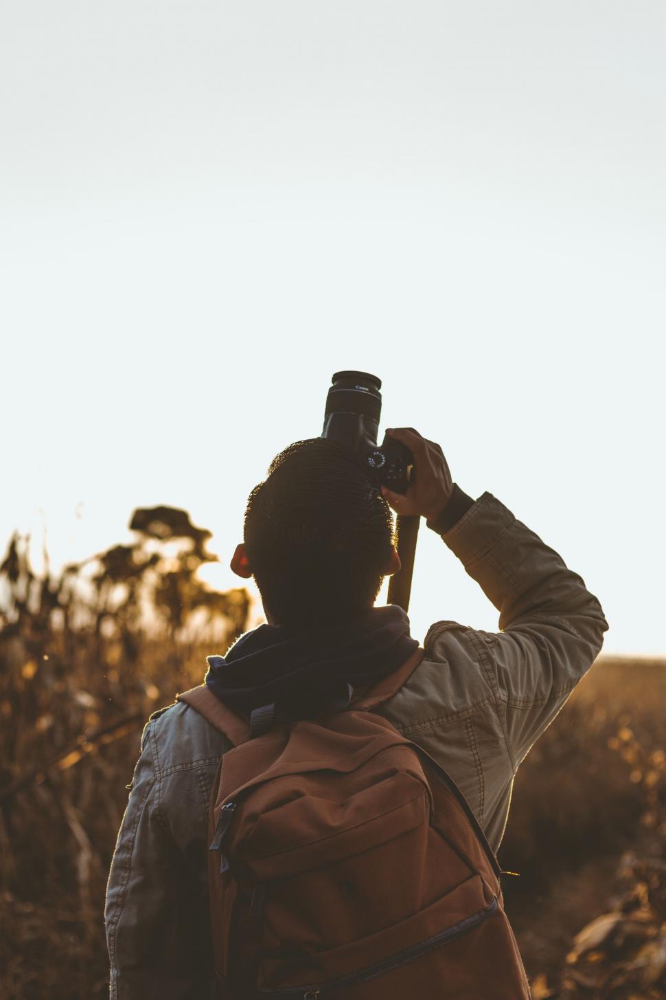 Free Image of Man Taking a Picture With a Camera 