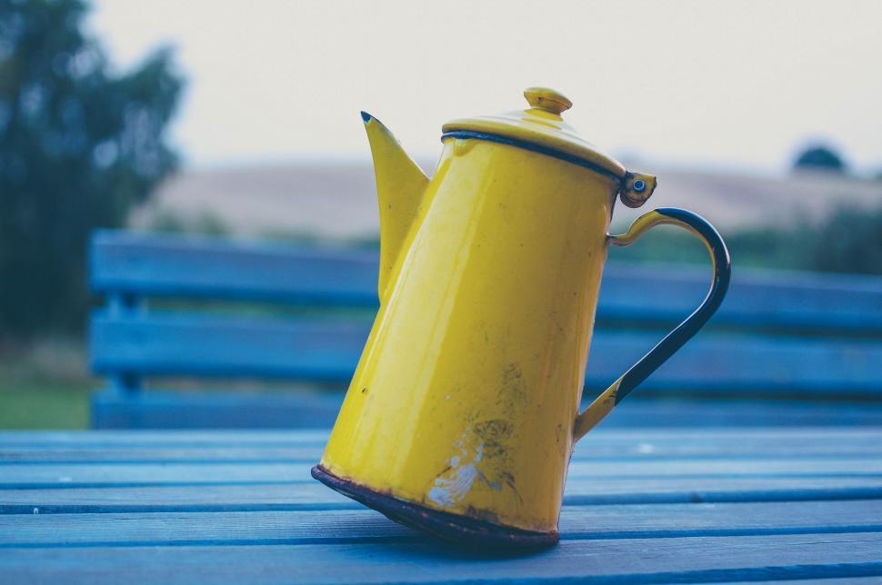Free Image of Yellow Tea Pot on Blue Table 