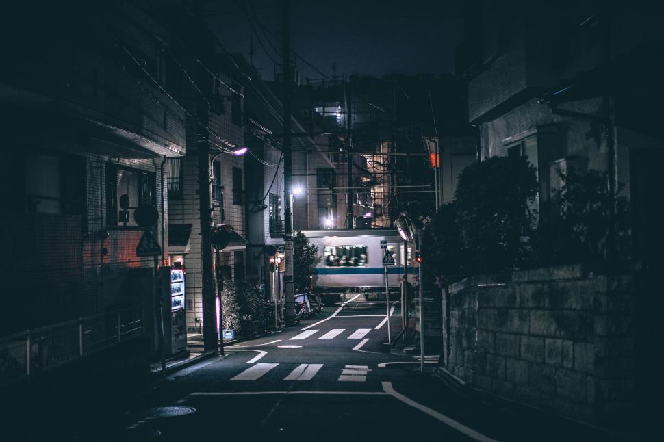 Free Image of Dark Alley at Night With Street Light On 