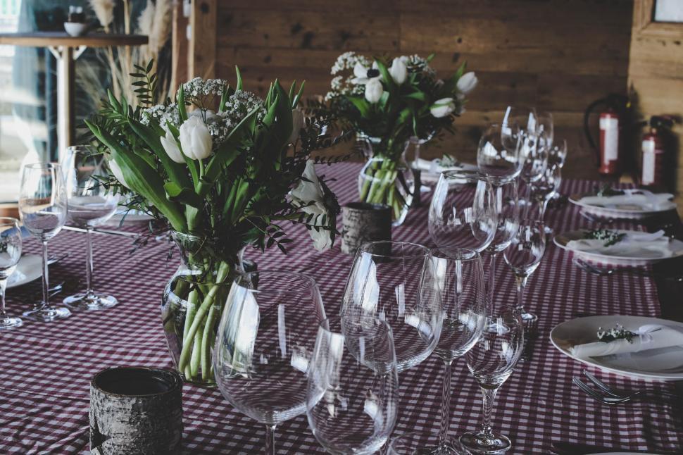 Free Image of Table Set With Wine Glasses and Flowers 