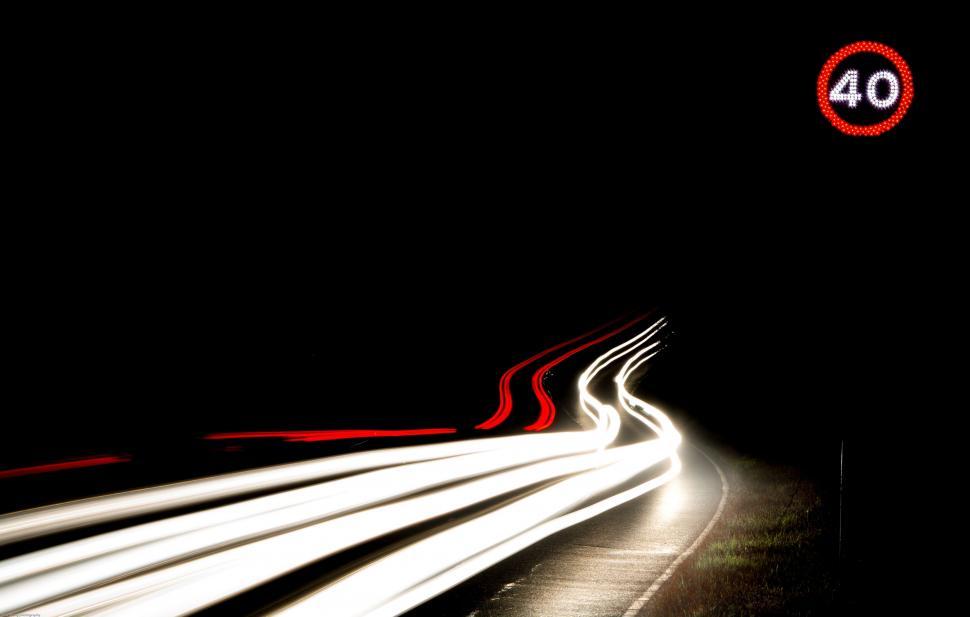 Free Image of Blurry Photo of a Highway at Night 