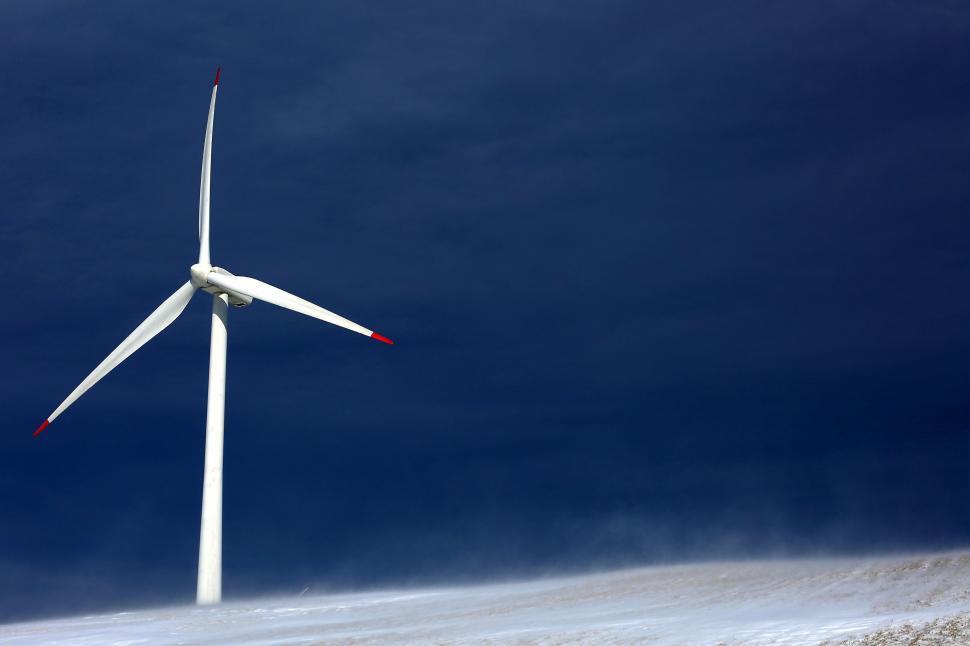 Free Image of Wind Turbine Standing Tall in Snowy Field 