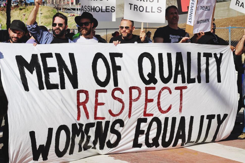 Free Image of Group of Men Holding Sign: Men of Quality Respect Womens 