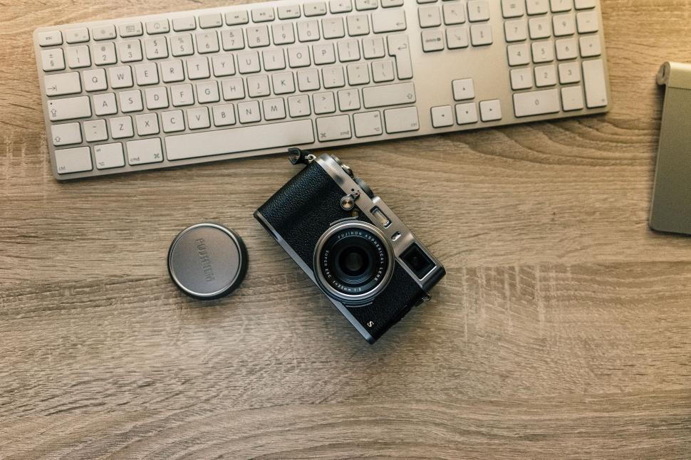 Free Image of Camera and Keyboard on Wooden Table 