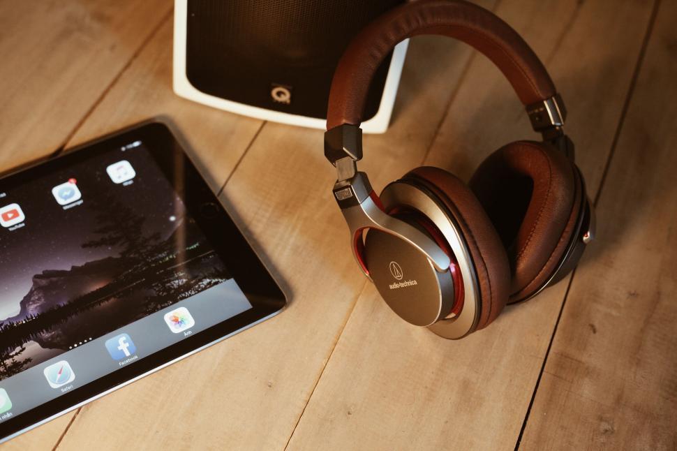 Free Image of Tablet and Headphones on Wooden Floor 