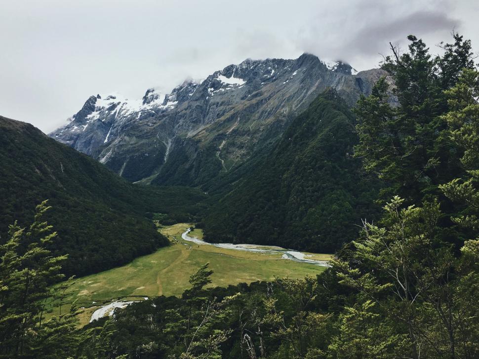 Free Image of Majestic Valley Surrounded by Mountains 
