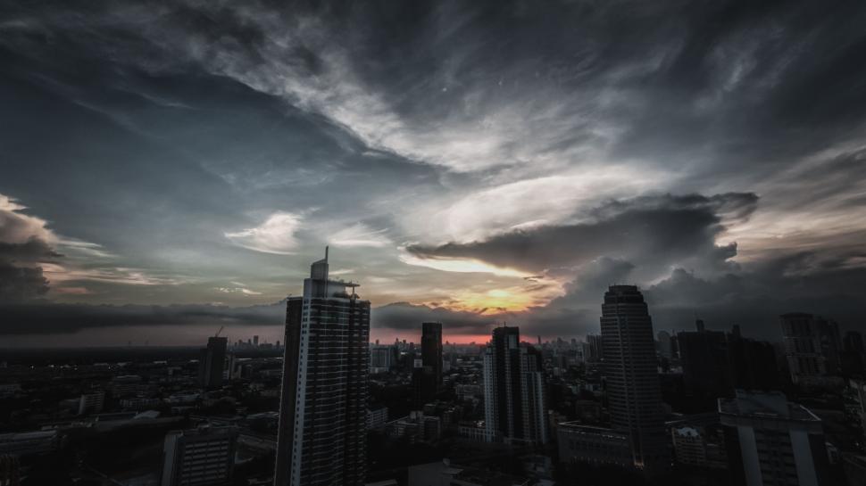 Free Image of Cloudy Sky Over City With Tall Buildings 