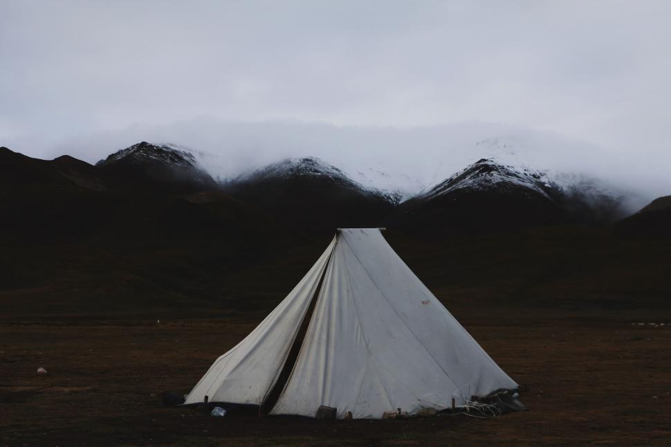 Free Image of White Tent in Field With Mountains Background 