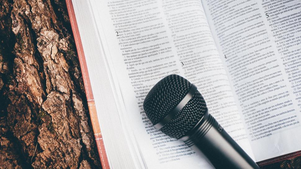 Free Image of Microphone on Top of an Open Book 