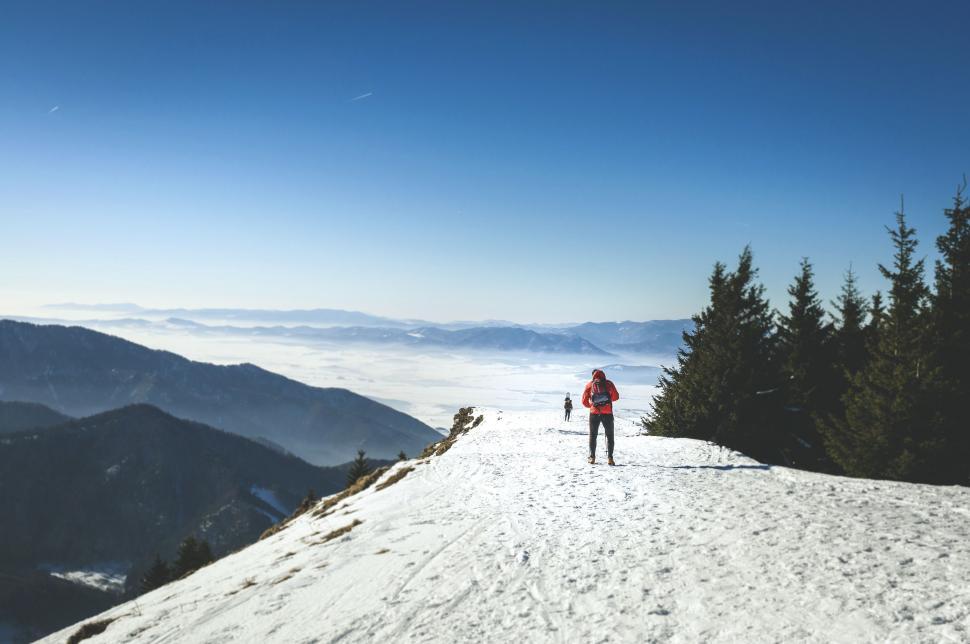 Free Image of Man Standing on Snow Covered Slope 