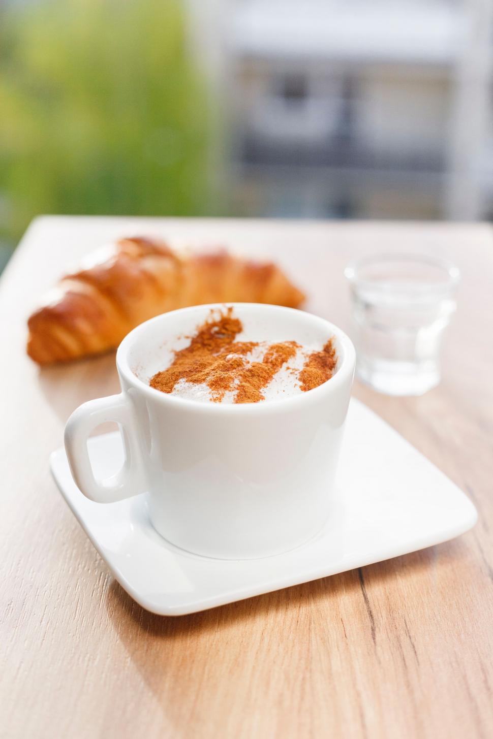 Free Image of A Cup of Coffee on a Saucer on a Table 