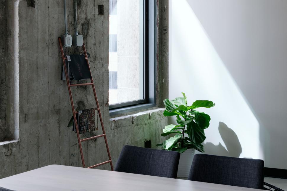 Free Image of Room With Table, Ladder, and Window 