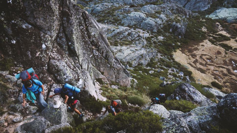 Free Image of Group of People Climbing Up a Mountain 