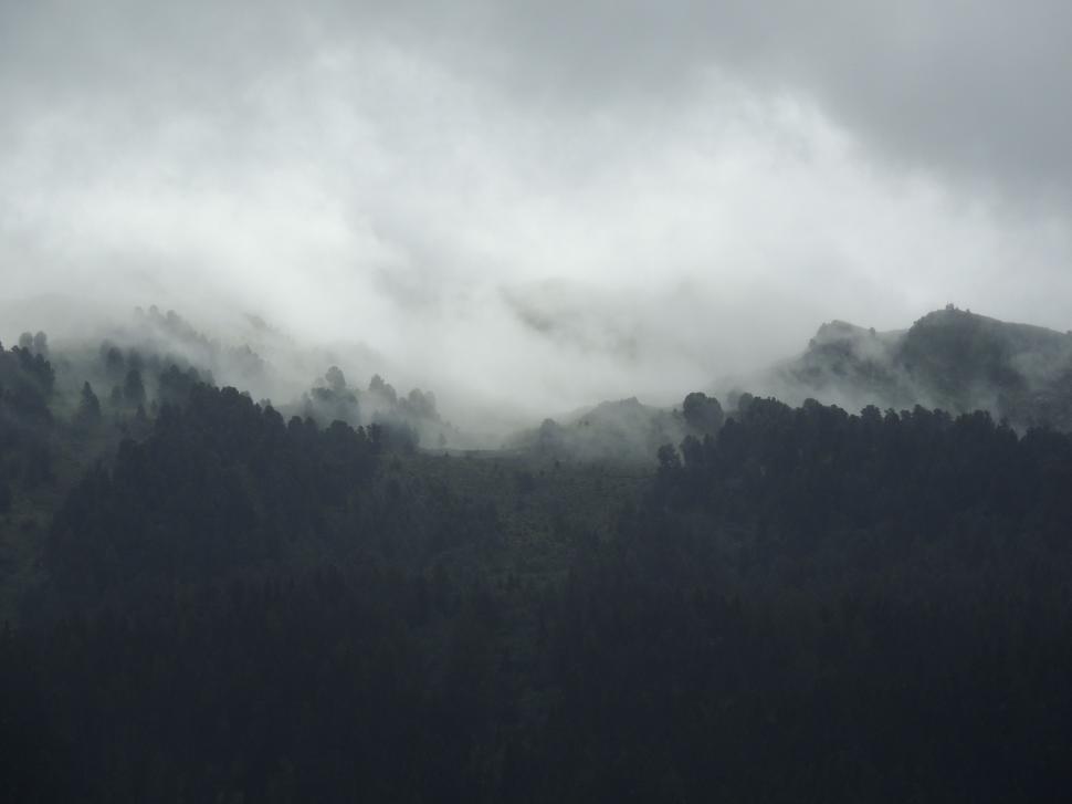 Free Image of Majestic Mountain Shrouded in Clouds 