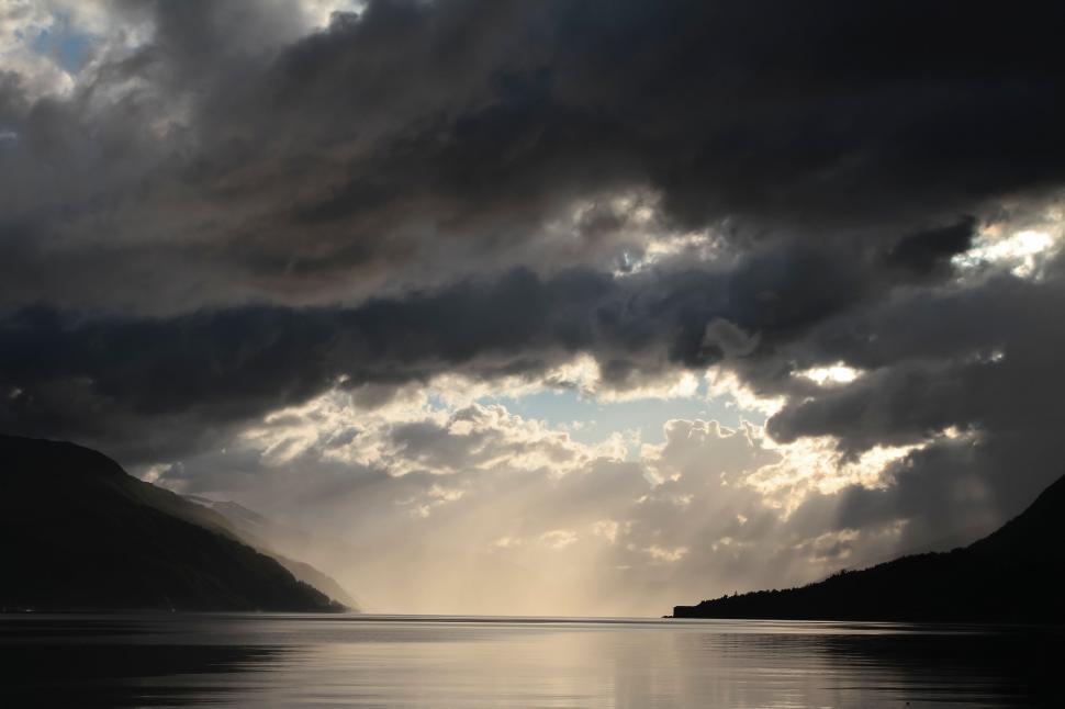 Free Image of Clouds Over a Body of Water 