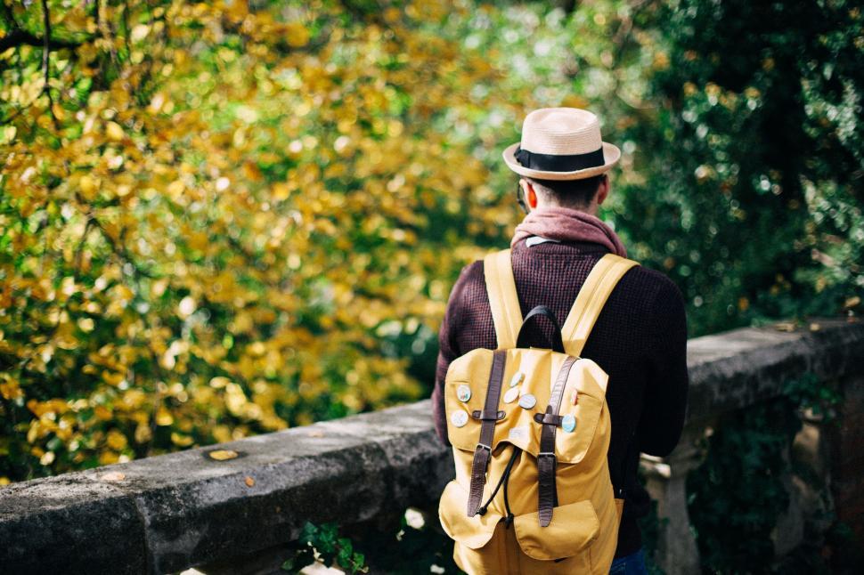 Free Image of Man With Yellow Backpack Walking 