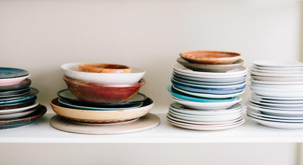 Free Image of A Display of Plates on a Shelf 