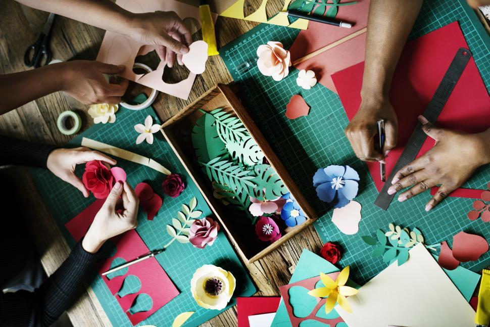 Free Image of Group Making Paper Flowers on Table 