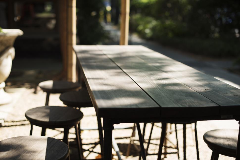 Free Image of Wooden Table With Four Stools 