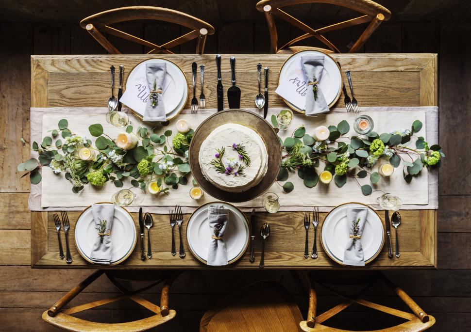 Free Image of Wooden Table Set With Plates and Silverware 